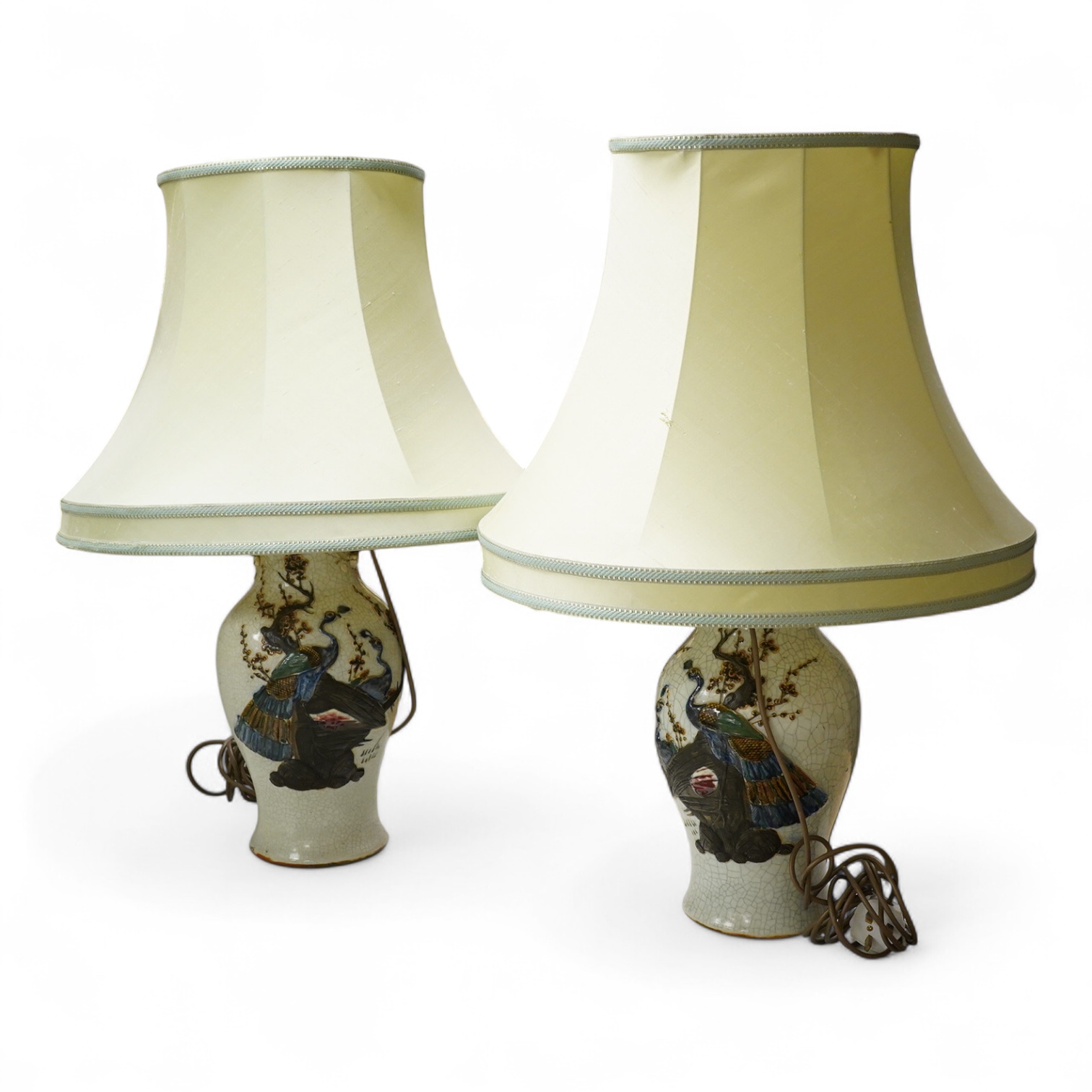 A large pair of early 20th century Chinese crackle glaze vases, mounted as table lamps, eac decorated in relief with peacocks, overall 80cm high